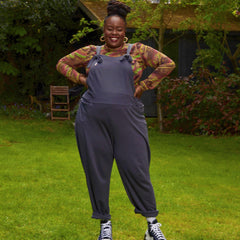 Woman wearing slate grey dungarees