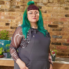 Woman wearing slate grey dungarees