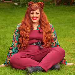 Woman wearing burgundy dungarees