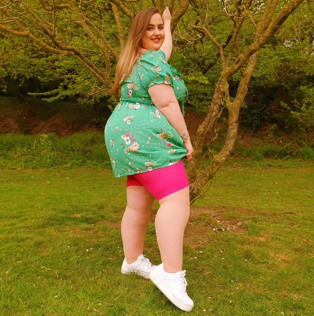 Woman wearing pomegranate chub rub shorts